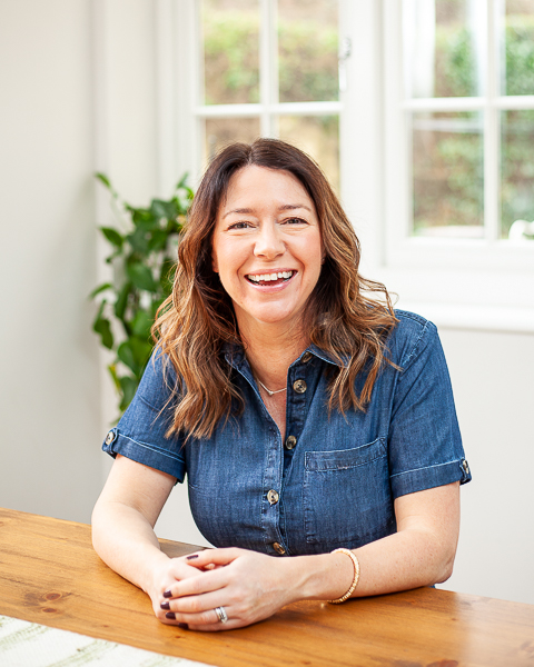 Warm and approachable branding portrait of [Business Name] owner during branding photography session in [Town], Hampshire.
