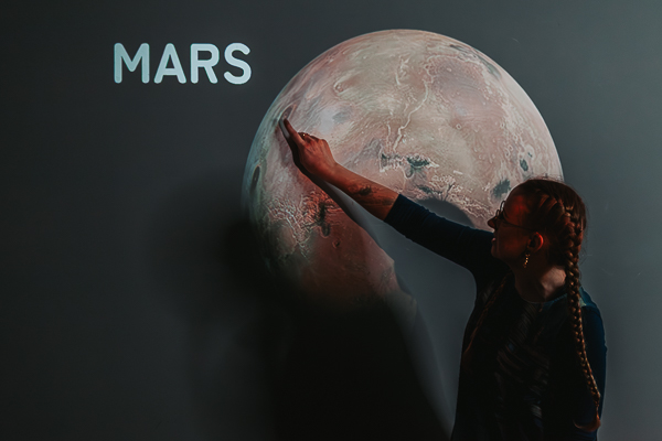 Confident business owner demonstrating expertise during event and branding photography session in Hartley Wintney, Hampshire.